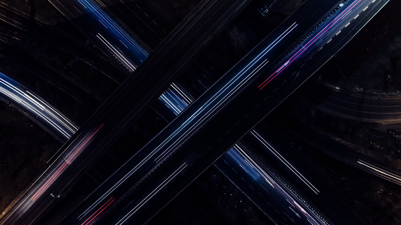 A multi-level highway, lit up at night.